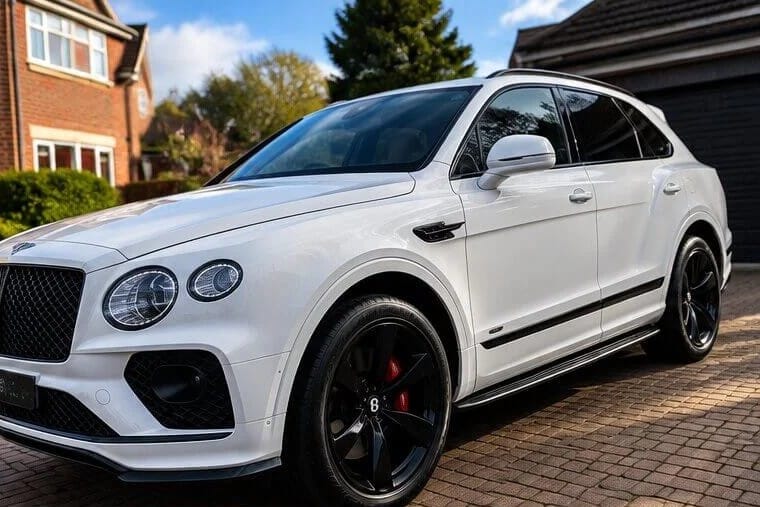 White Bentley Bentayga on a driveway